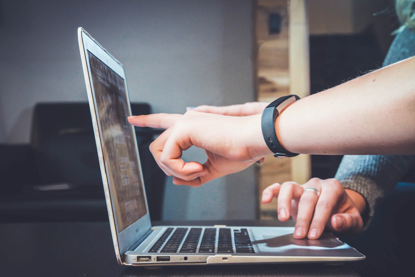 Colleagues working together on a laptop