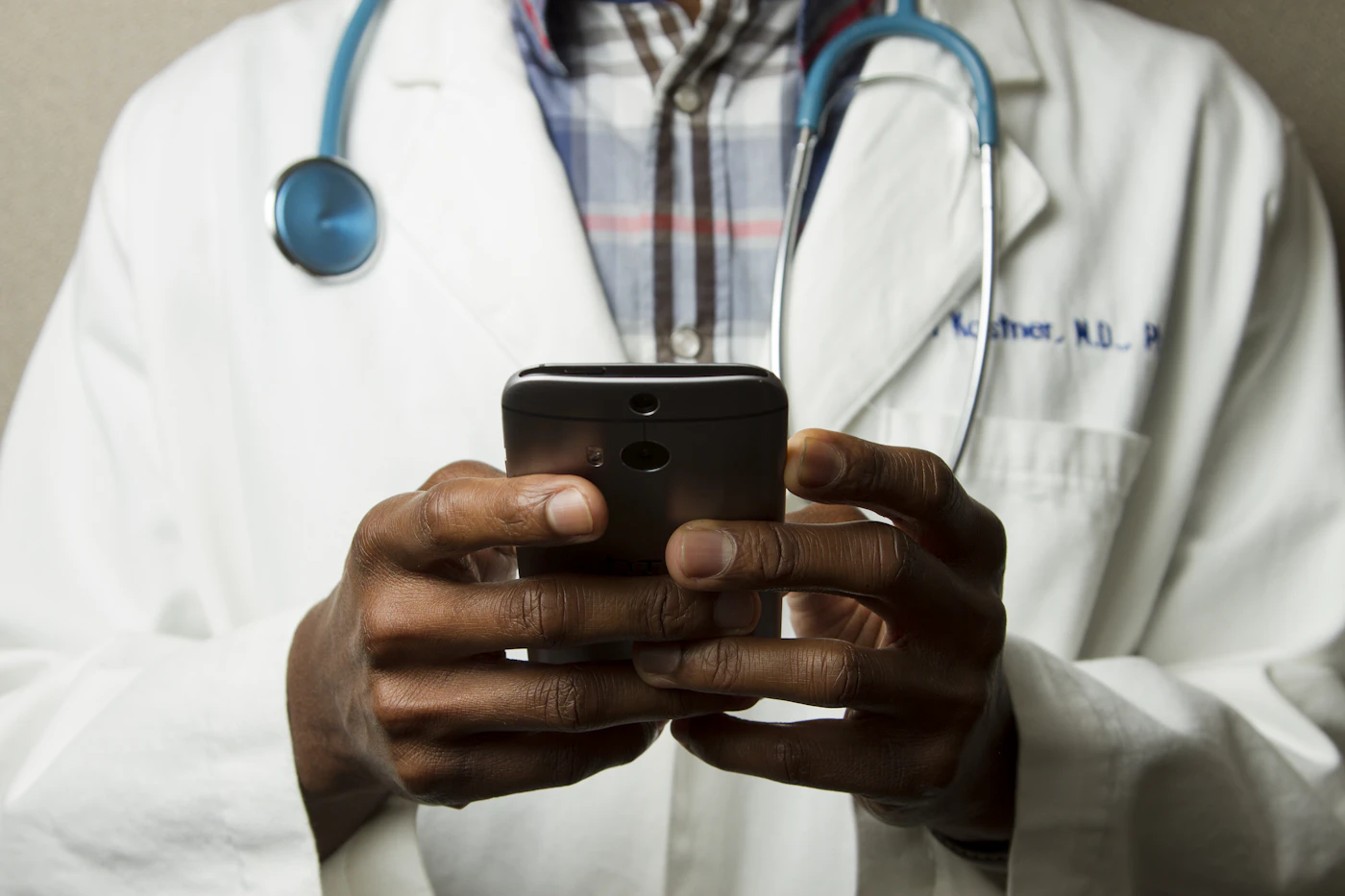 A healthcare professional using a mobile device